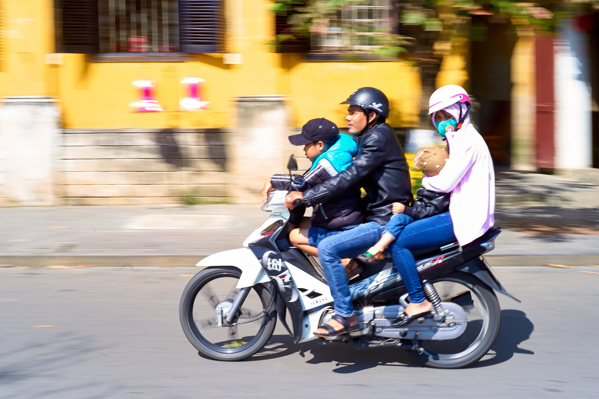 Motorcycle family in Hanoi, Vietnam; LEICA M10 50mm ISO-100 1/45sec