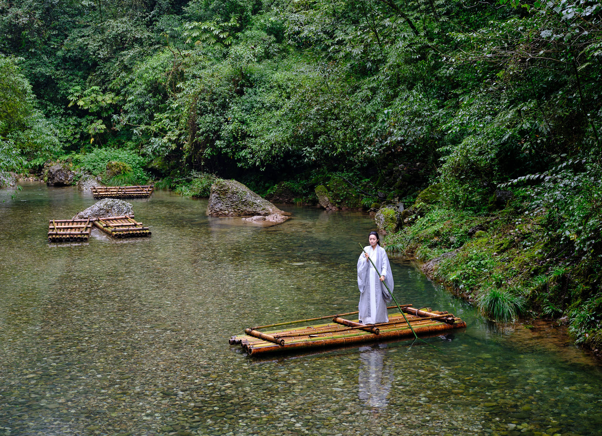 Ancient dress lady on a raft at Qingcheng Mountain