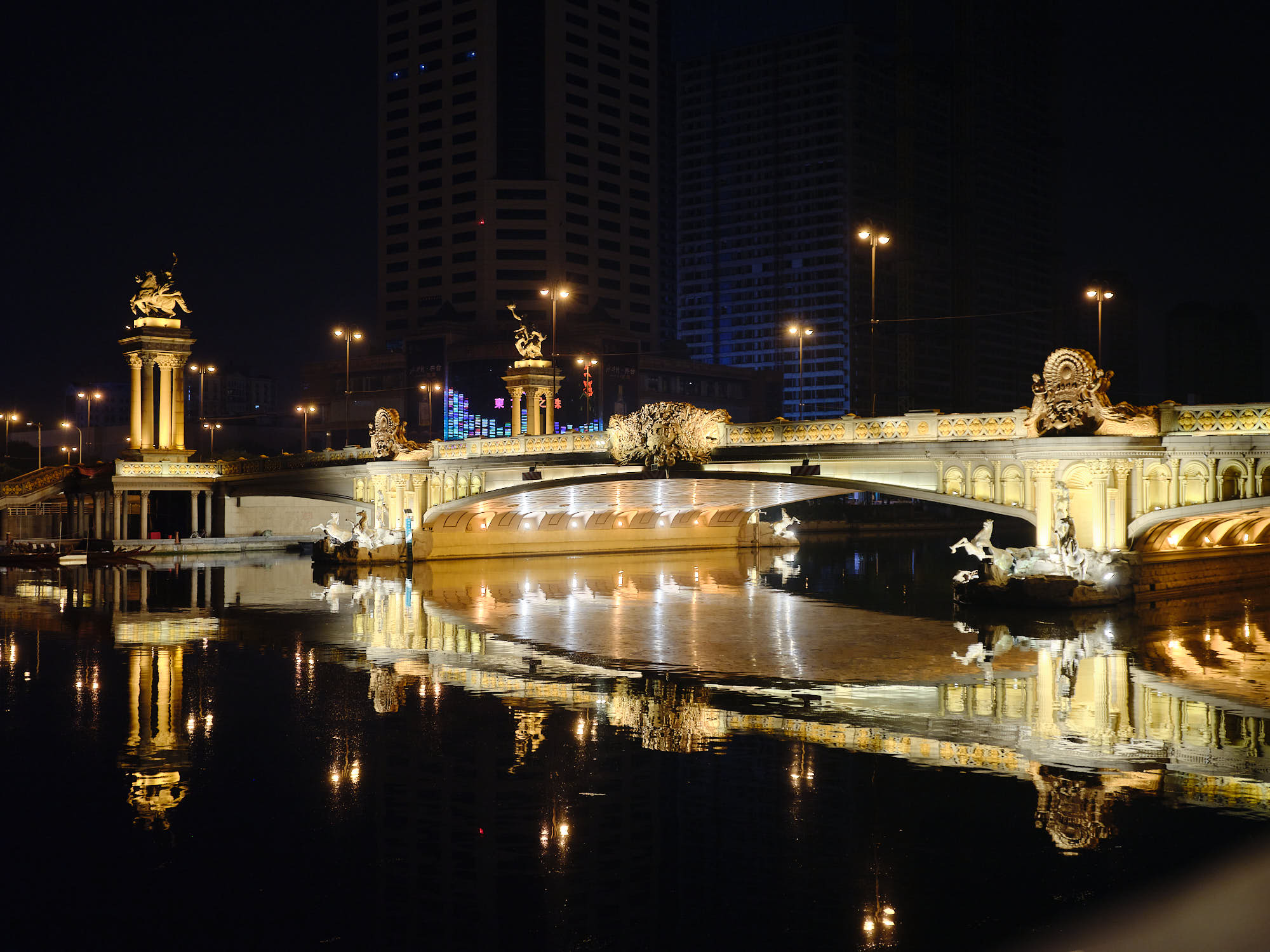 Lit bridge at night in Tianjin, China