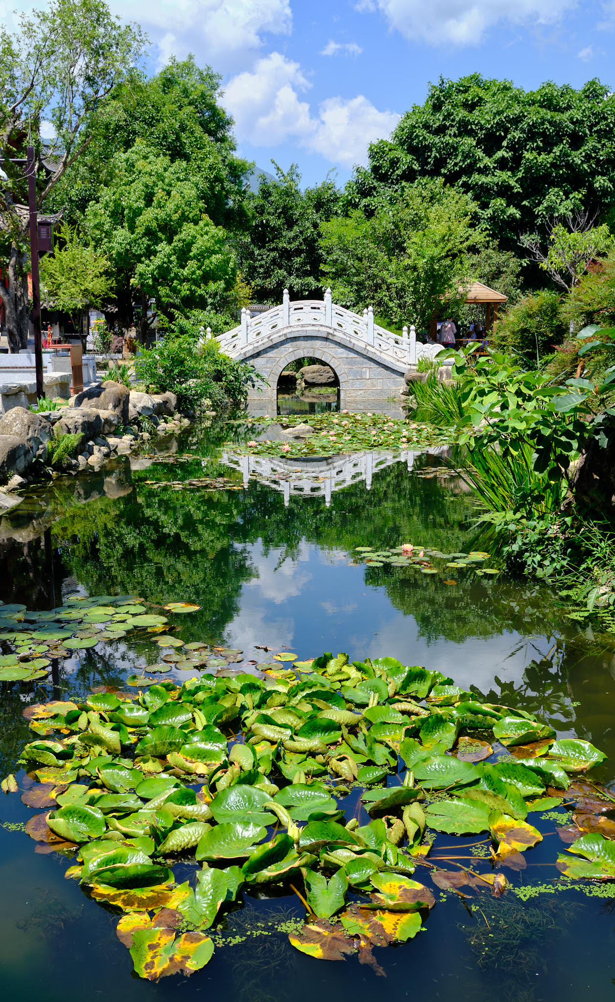 Entrance bridge and water reflection at Xizhou Ancient Town