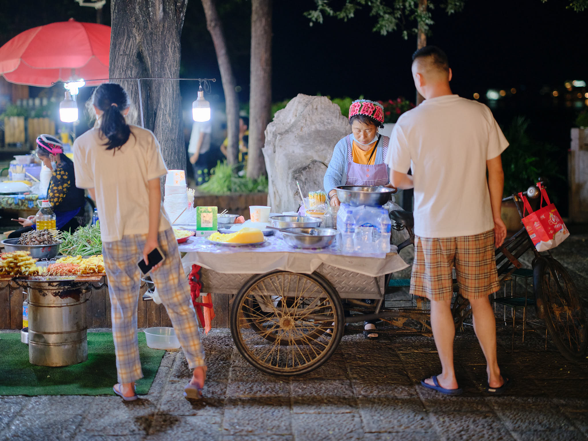 Vendors selling products on the streets of Shuanglang Ancient Town