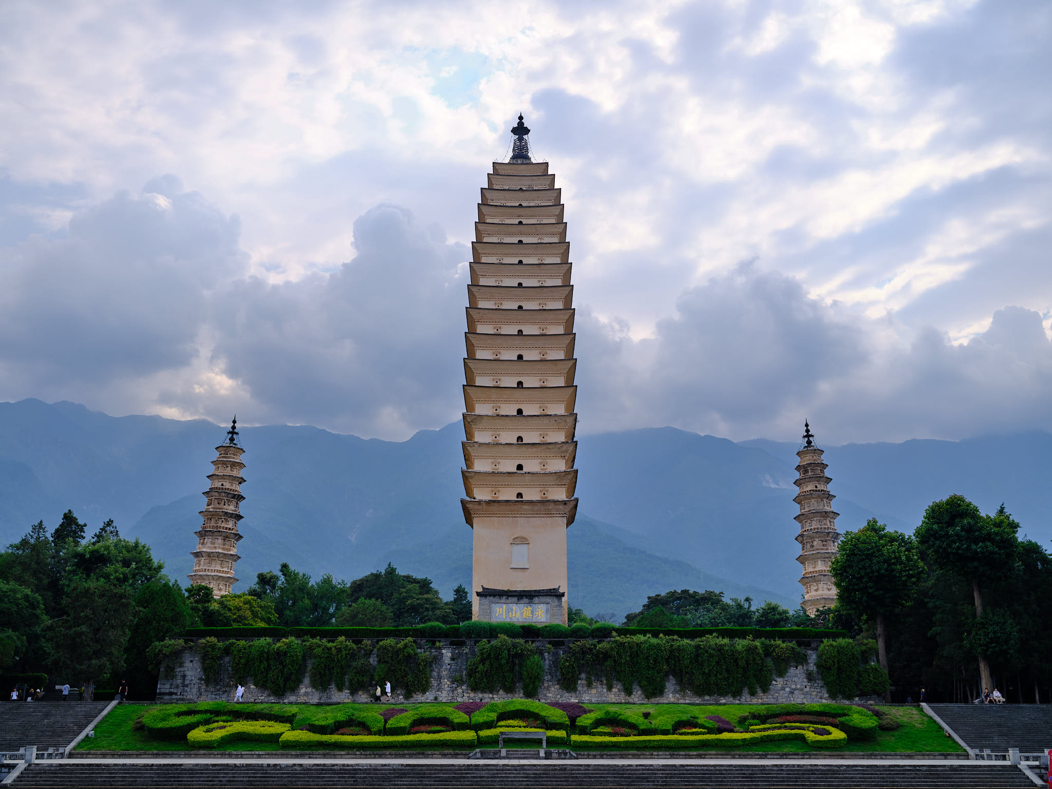 Three Pagodas front view with mountains in the back