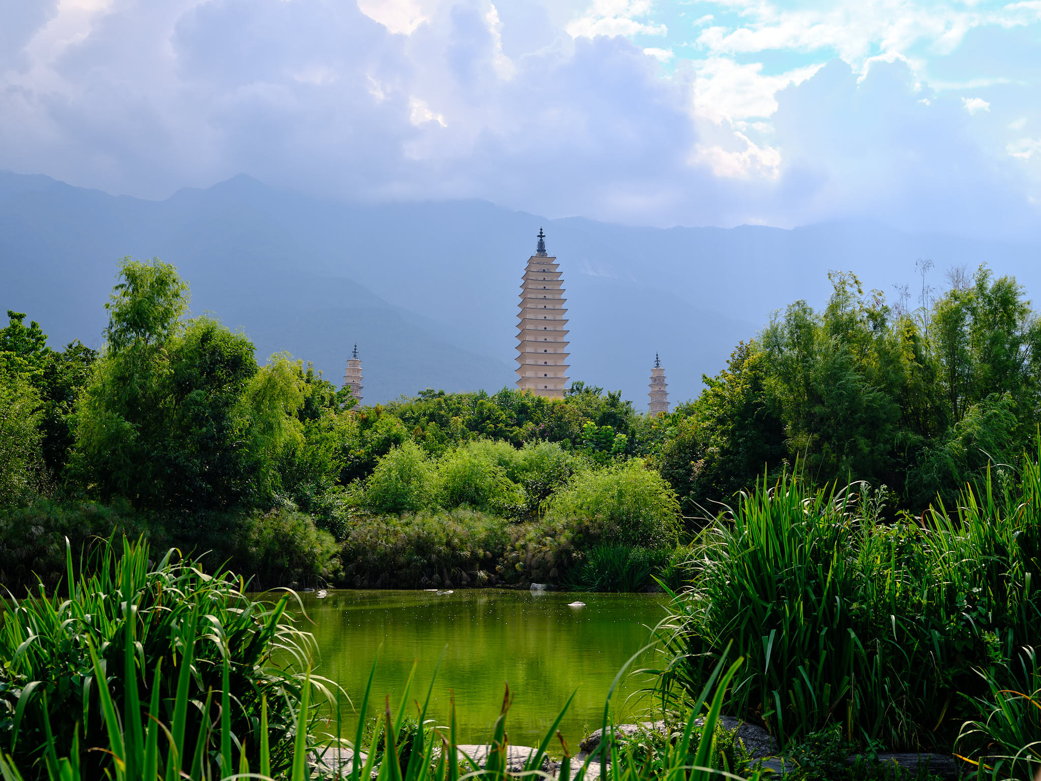 Three Pagodas reflecting in the green lake