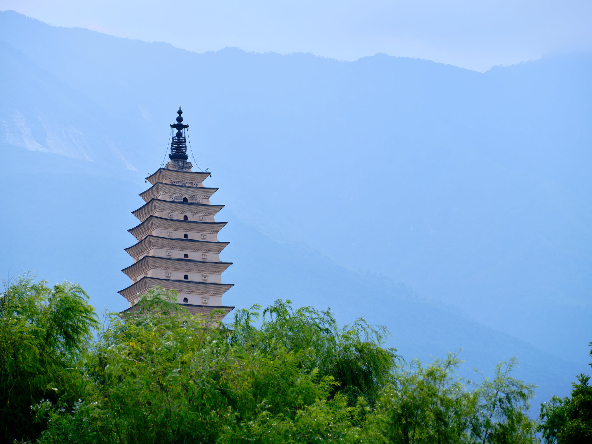 Three Pagodas with mountain backdrop