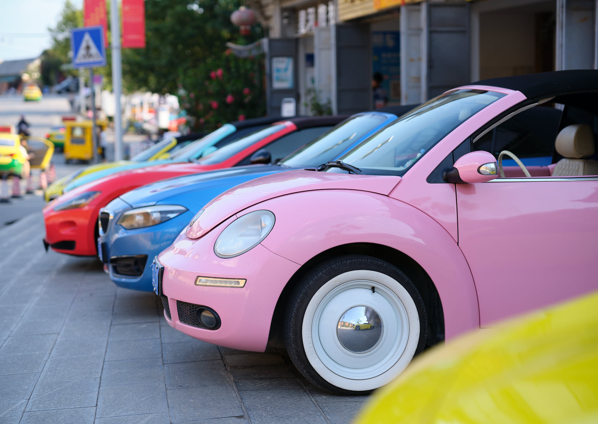 Wild coloured rental cars for tourists in Dali