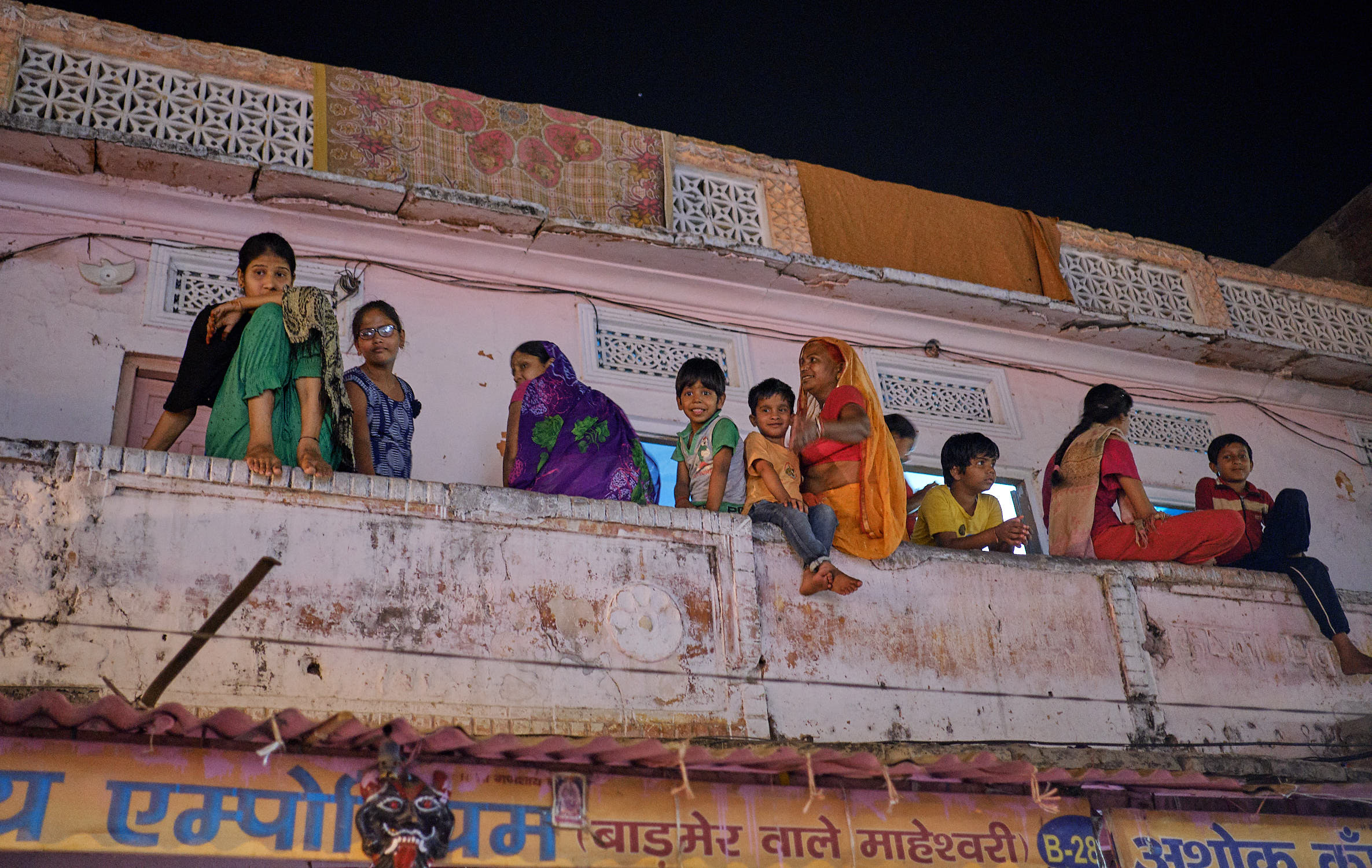 Family on ledge in Jaipur, India